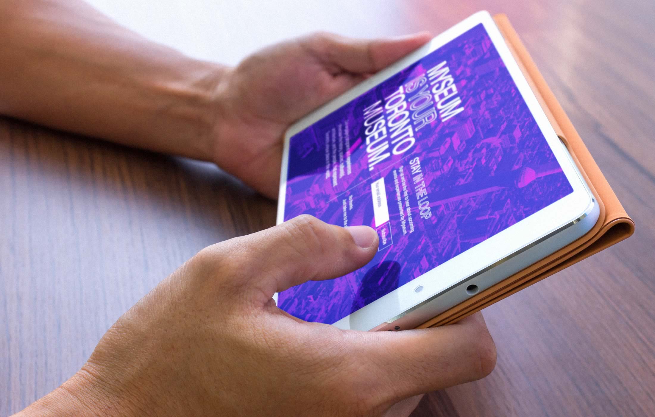 Closeup of a person interacting with the Myseum website on their tablet