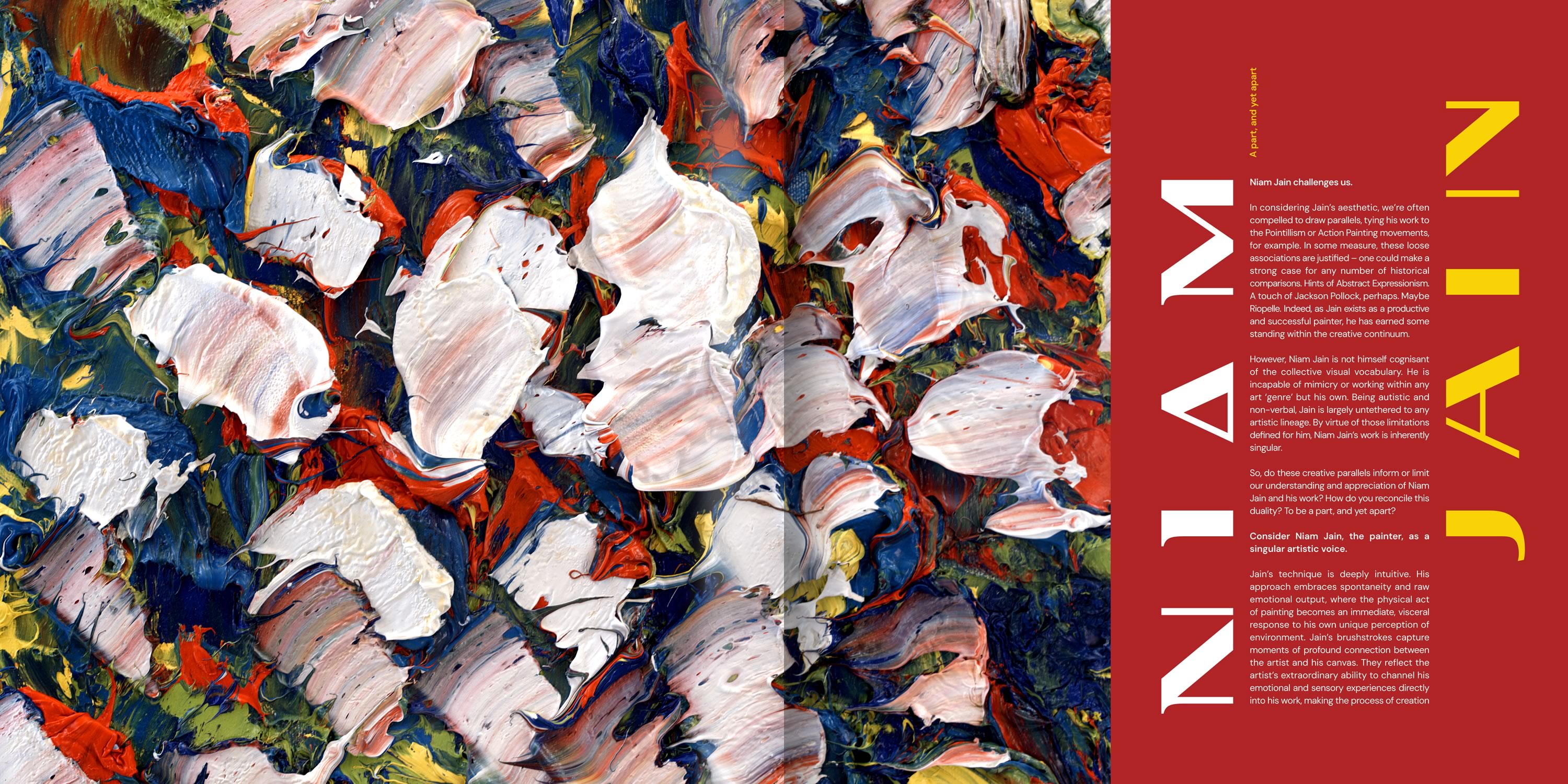 Image of two men hugging amongst a larger crowd of young adults (upon completion of an outdoor trek)