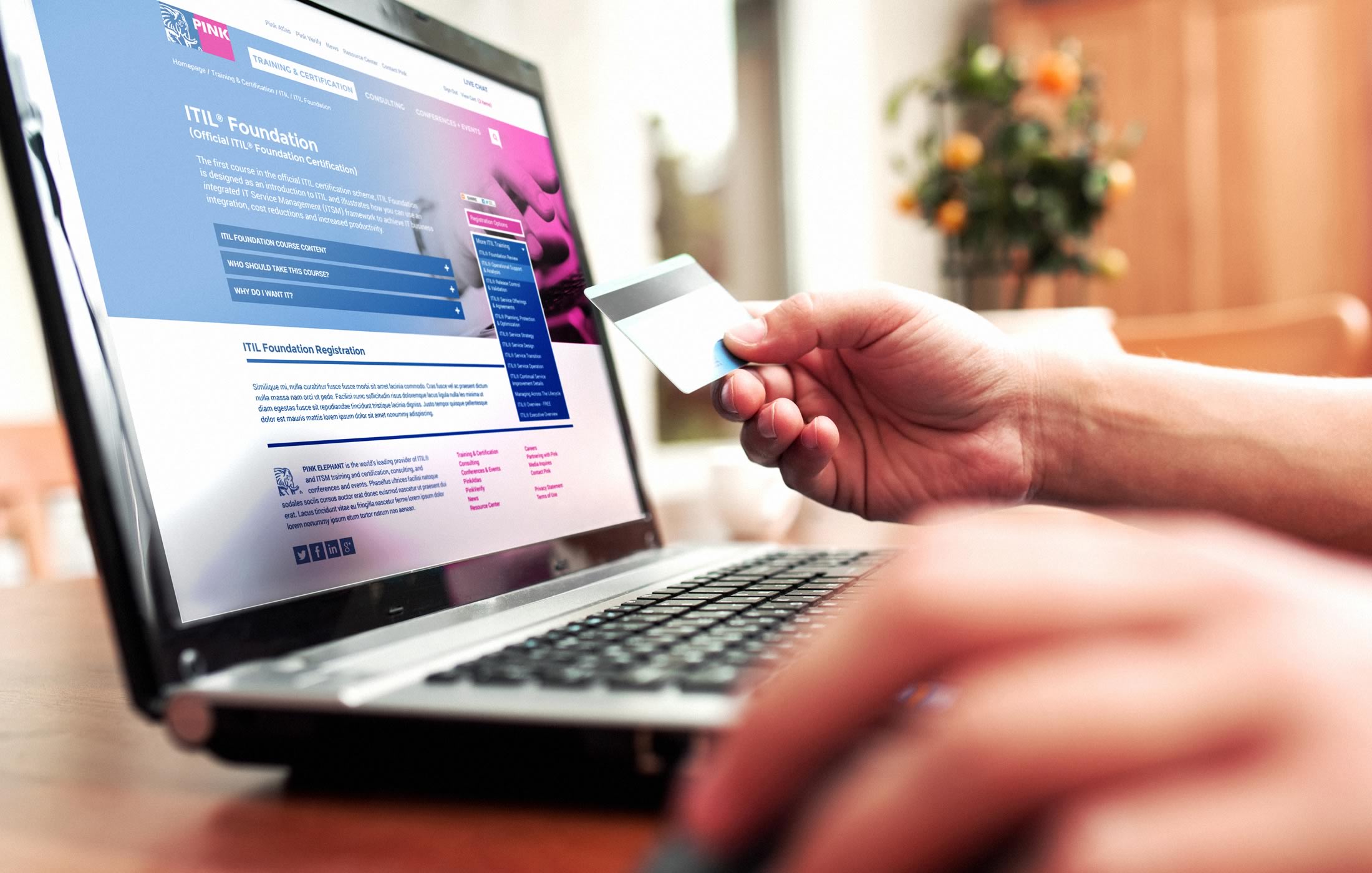 Closeup of a person purchasing a course from the Pink Elephant website on their desktop computer