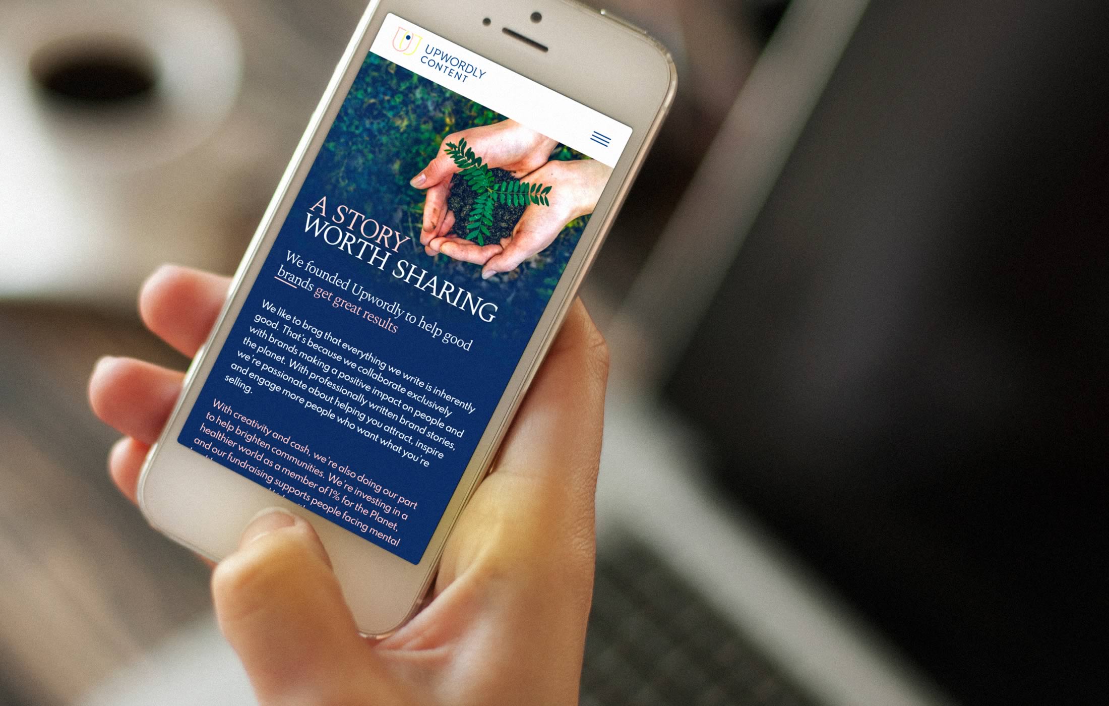 Closeup of a person interacting with the Upwordly Content website on their mobile phone