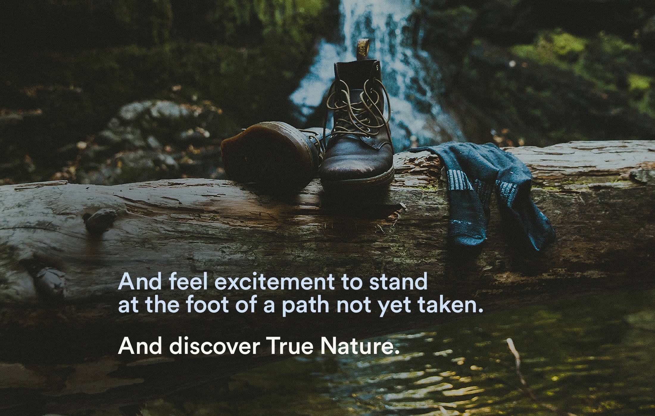 Image of clothes set out to dry at riverside, captioned as 'And feel the excitement to stand at the foot of a path not yet taken.'